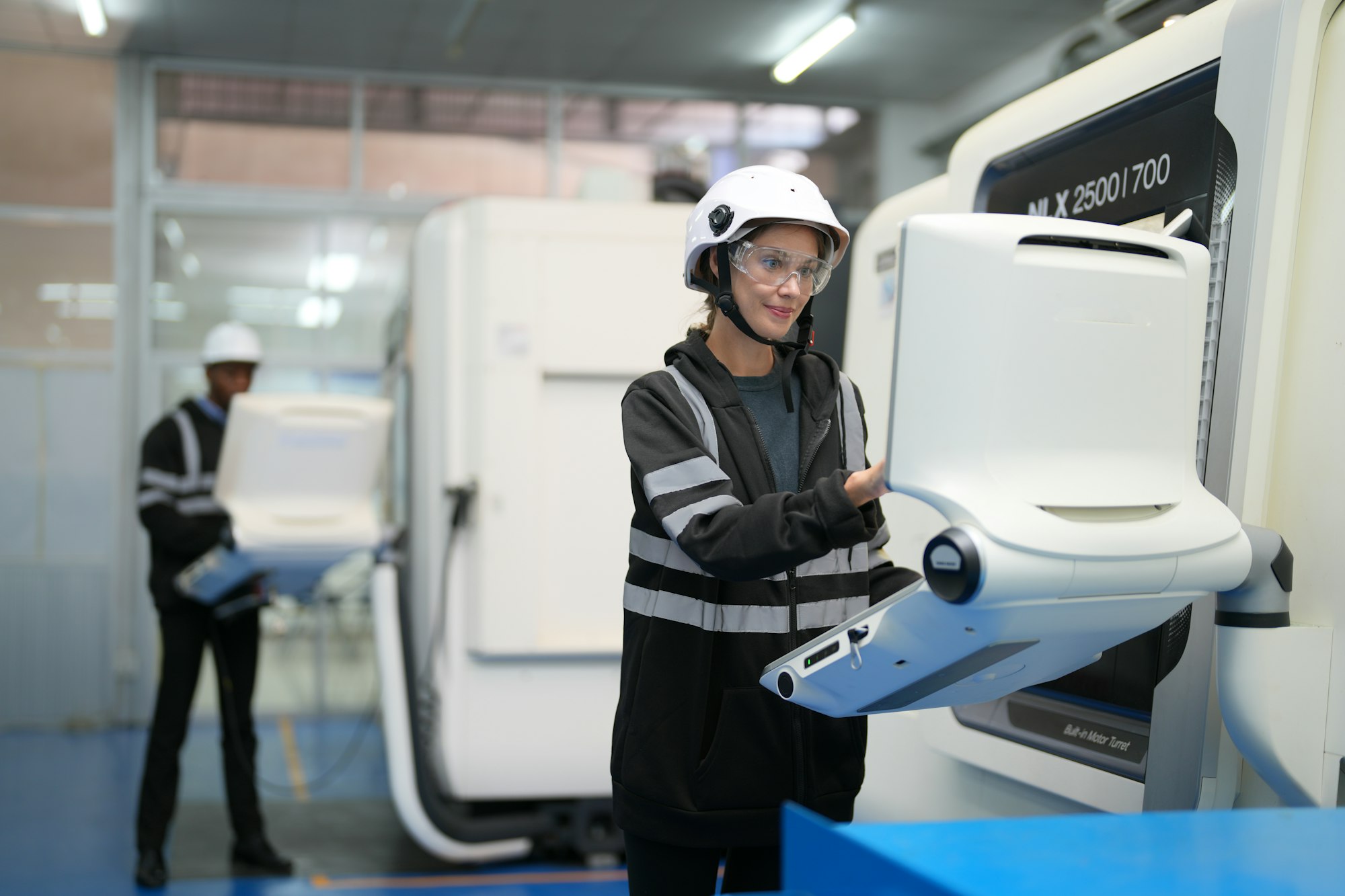 Robotic Arm engineer check on equipment in its with software of an Artificial Intelligence Computer